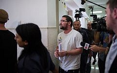 Nachman Tuito, member of the right-wing Lehava organization seen outside the courtroom of the District Court in Jerusalem, July 22, 2015. (Yonatan Sindel/Flash90)