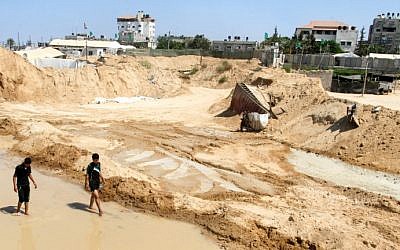 Palestinians inspect the damage after Egyptian forces flooded smuggling tunnels dug beneath the Gaza-Egypt border, in Rafah in the southern Gaza Strip, on September 18, 2015. (Abed Rahim Khatib/ Flash90) Palestinians inspect the damage after Egyptian forces flooded smuggling tunnels dug beneath the Gaza-Egypt border, in Rafah in the southern Gaza Strip, on September 18, 2015. (Abed Rahim Khatib/ Flash90)