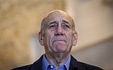 Former prime minister Ehud Olmert speaks to the press at the Supreme Court in Jerusalem on December 29, 2015. (Amit Shabi/Pool)