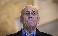 Former prime minister Ehud Olmert speaks to the press at the Supreme Court in Jerusalem on December 29, 2015. (Amit Shabi/Pool)