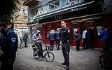 Israeli police stand outside a pub on Dizengoff Street in central Tel Aviv, on January 2, 2016, a day after two people were killed in a shooting there (Miriam Alster/Flash90)