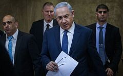 Prime Minister Benjamin Netanyahu on his way to the cabinet meeting in Jerusalem on January 3, 2016. (Alex Kolomoisky/Pool)