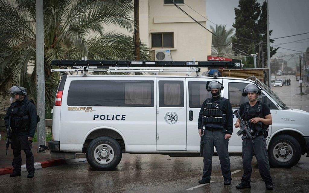 Israeli security forces blocking a road in the Israeli Arab village of Arara, northern Israel on January 8, 2016, as Nashat Milhem is tracked down. (Basel Awidat/Flash90)