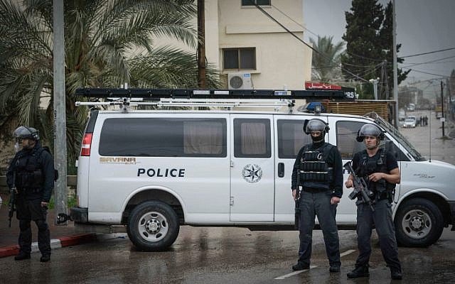 Israeli security forces blocking a road in the Israeli Arab village of Arara, northern Israel on January 8, 2016, as Nashat Milhem is tracked down. (Basel Awidat/Flash90)