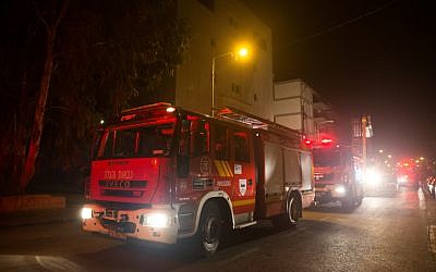 Firefighting teams work to put out a fire at the building where the offices of the human rights NGO B'Tselem are located, in Jerusalem on January 10, 2016. Police were investigating whether it was arson. (Yonatan Sindel/Flash90) Firefighting teams work to put out a fire at the building where the offices of the human rights NGO B'Tselem are located, in Jerusalem on January 10, 2016. Police were investigating whether it was arson. (Yonatan Sindel/Flash90)