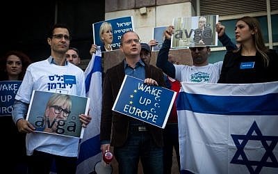 Yisrael Beytenu MK Oded Forer seen with party supporters outside the Swedish Embassy in Tel Aviv, on January 15, 2016. (Miriam Alster/Flash90)