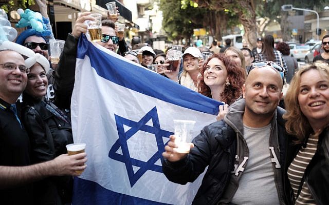 Israelis attend a street party at the Simta Bar on Dizengoff Street in Tel Aviv on January 15, 2016, in support of the bar where two Israelis were killed and several more injured in a shooting attack two weeks ago. (Photo by Tomer Neuberg/FLASH90) Israelis attend a street party at the Simta Bar on Dizengoff Street in Tel Aviv on January 15, 2016, in support of the bar where two Israelis were killed and several more injured in a shooting attack two weeks ago. (Photo by Tomer Neuberg/FLASH90)
