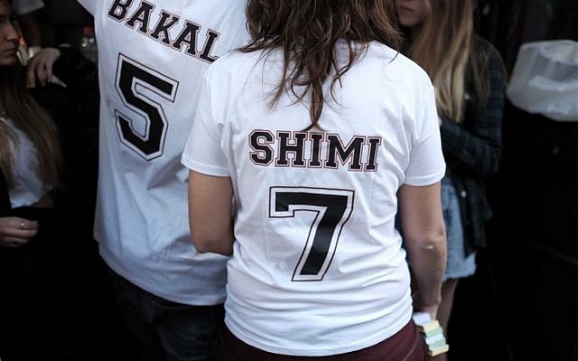 Patrons wear t-shirts bearing the names of the two Israelis killed two weeks ago in a shooting attack at the Simta bar in Tel Aviv, as they attend a street party in support of the pub on January 15, 2016. (Photo by Tomer Neuberg/FLASH90) Patrons wear t-shirts bearing the names of the two Israelis killed two weeks ago in a shooting attack at the Simta bar in Tel Aviv, as they attend a street party in support of the pub on January 15, 2016. (Photo by Tomer Neuberg/FLASH90)