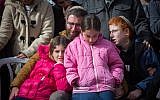 The family of Dafna Meir at her funeral in Jerusalem on January 18, 2106. Meir was stabbed to death at the entrance to her home in the settlement of Otniel on January 17. (Yonatan Sindel/Flash90)