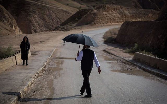 A Haredi man seen visiting Wadi Og in the Judean Desert, south of Jerusalem, on January 24, 2016. (Hadas Parush/Flash90)