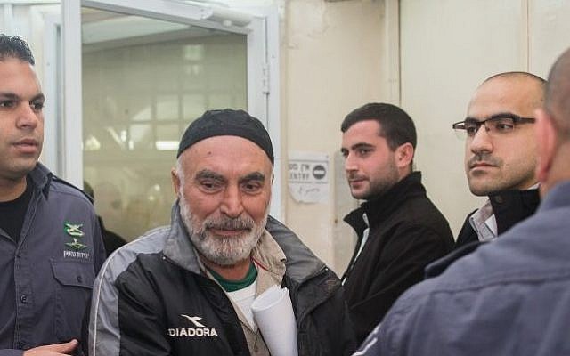 Ezra Nawi (center) seen at the Jerusalem Magistrate's Court, January 24, 2016. (Yonatan Sindel/Flash90) Ezra Nawi (center) seen at the Jerusalem Magistrate's Court, January 24, 2016. (Yonatan Sindel/Flash90)