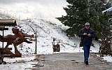 A man walks in the snow in the Golan Heights in northern Israel on January 25, 2016, as a major winter storm hits the country. (Photo by Basel Awidat/Flash90)