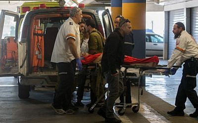 An Israeli man wounded in a shooting attack in the West Bank is wheeled into the emergency room at Shaare Zedek Medical Center in Jerusalem on Sunday, January 31, 2016 (Yonatan Sindel/Flash90)
