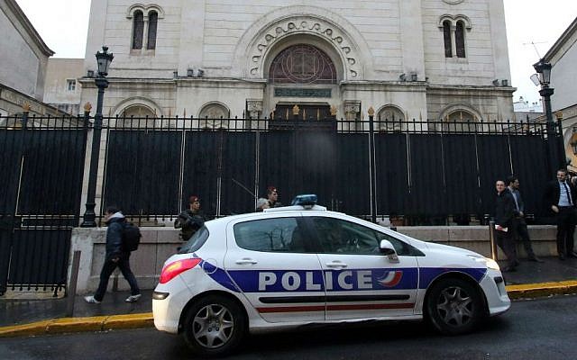 Illustrative. Police guard a synagogue during a visit by French Interior Minister Bernard Cazeneuve, in Marseille, southern France, January 14, 2016. (AP Photo/Claude Paris) Illustrative. Police guard a synagogue during a visit by French Interior Minister Bernard Cazeneuve, in Marseille, southern France, January 14, 2016. (AP Photo/Claude Paris)