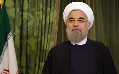 Iranian President Hassan Rouhani waits before a meeting with French Senate President Gerard Larcher, in Paris, Wednesday, January 27, 2016. (AP Photo/Christophe Ena)
