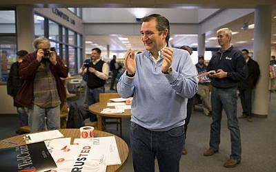 Republican presidential candidate, Sen. Ted Cruz, R-Texas smiles while listening to his introduction at a campaign event, Friday, Jan. 29, 2016, in Emmetsburg, Iowa. (AP Photo/Jae C. Hong) 