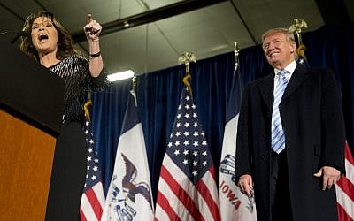 Former Alaska Gov. Sarah Palin, left, endorses Republican presidential candidate Donald Trump during a rally at the Iowa State University, Tuesday, Jan. 19, 2016, in Ames, Iowa. (AP Photo/Mary Altaffer)