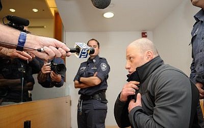 Gennady Galkin arrives to a court hearing at the Haifa Magistrates Court Janaury 20, 2016, Gelkin was arrested in Berlin on Wednesday after being a suspect of murdering Edward Rothberg, 25, at a club in Haifa in 1998. Photo by Basel Awidat/Flash90.

??? ????