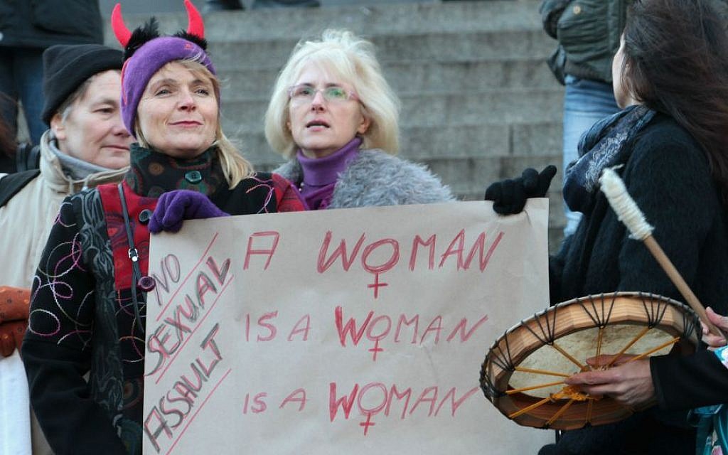 Participants of a women's flash mob demonstrate against racism and sexism in Cologne, Germany, Saturday, Jan. 9, 2016. (AP Photo/Juergen Schwarz)