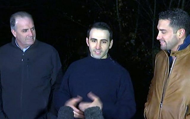 In this image made from video, former U.S Marine Amir Hekmati, center, is flanked by Michigan congressman Dan Kildee, left, and Hekmati's brother-in-law Ramy Kurdi as he speaks to the media in Landstuhl, Germany, Tuesday, Jan. 19, 2016. (APTN via AP) In this image made from video, former U.S Marine Amir Hekmati, center, is flanked by Michigan congressman Dan Kildee, left, and Hekmati's brother-in-law Ramy Kurdi as he speaks to the media in Landstuhl, Germany, Tuesday, Jan. 19, 2016. (APTN via AP)