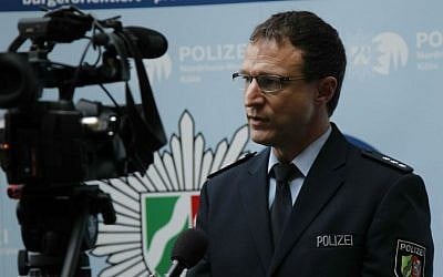 Cologne police spokesman Christoph Gilles speaks during an interview with The Associated Press in Cologne, Germany, Wednesday, Jan. 6, 2016, after 106 women complain to police that they were sexually assaulted in the city on New Year's Eve.(AP Photo/Hermann J. Knippertz)