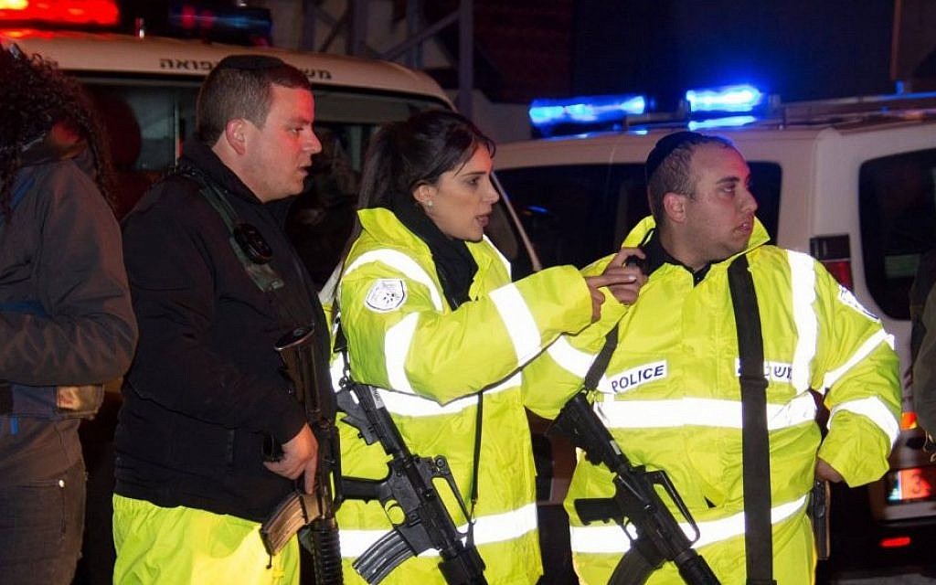 Police officers at the scene of a terror attack in which two people were wounded by two Palestinian stabbers, in the West Bank settlement of Beit Horon on Monday, January 25 2016 .(Israel Police)