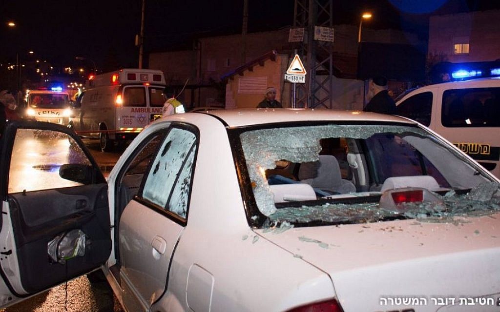 A car with its windshield shattered by bullets, at the scene of a terror attack in which two people were wounded by two Palestinian stabbers, in the West Bank settlement of Beit Horon on Monday, January 25 2016 .(Israel Police)