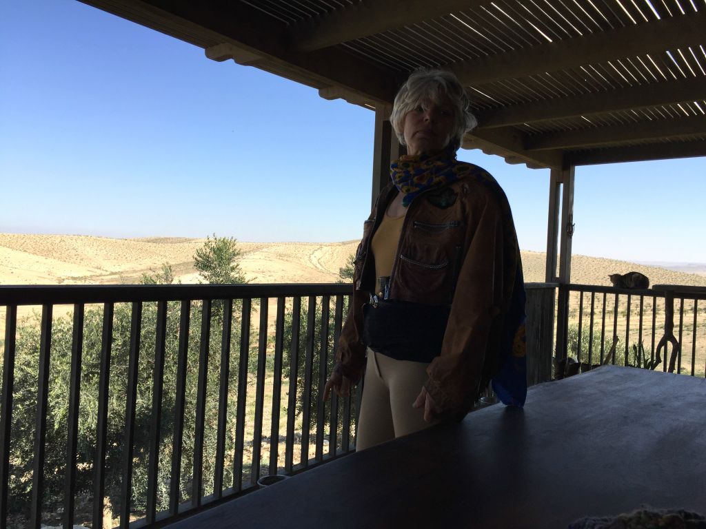 Tchia Efron Klinger, in her jodphurs and with her gun, a rancher living in the Negev (Jessica Steinberg/Times of Israel)