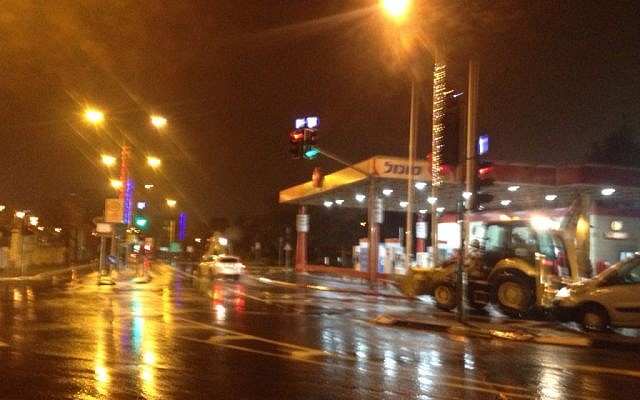 Tractors readying to remove snow as the white stuff begins to fall in Jerusalem on January 25, 2016. (Joshua Davidovich/Times of Israel)