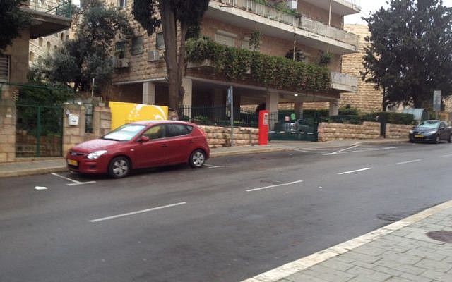 A car displays the extent of snow (almost none) in jerusalem on January 26, 2016. (Joshua Davidovich/Times of Israel)