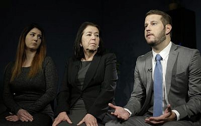 Christine Levinson, center, wife of Robert Levinson, and her children, Dan and Samantha Levinson, talk to reporters in New York, Monday, Jan. 18, 2016. (AP Photo/Seth Wenig)