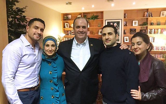 In a Monday, Jan. 18, 2016 photo provided by the Hekmati family, the family and U.S. Rep. Dan Kildee, D-Flint Township, Mich.,meet with former Iran prisoner Amir Hekmati, second from right, at Landstuhl Regional Medical Center in Landstuhl, Germany. (Courtesy of the Hekmati Family via AP) 