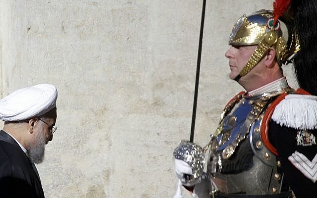 Iranian President Hassan Rouhani, left, walks past a courassier presidential guard as he arrives to meet Italian President Sergio Mattarella at the Quirinale presidential palace in Rome, Monday, Jan. 25, 2016. (AP Photo/Gregorio Borgia) Iranian President Hassan Rouhani, left, walks past a courassier presidential guard as he arrives to meet Italian President Sergio Mattarella at the Quirinale presidential palace in Rome, Monday, Jan. 25, 2016. (AP Photo/Gregorio Borgia)