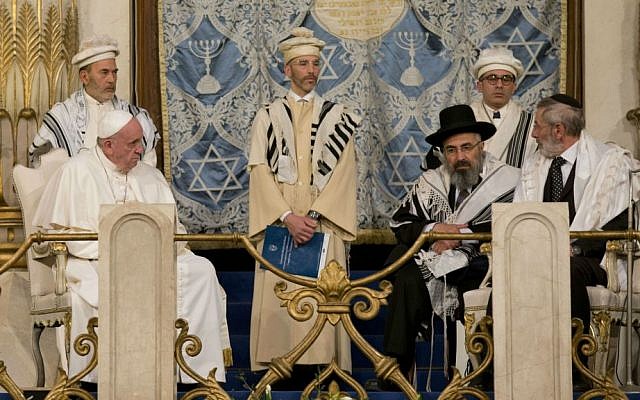 Pope Francis sits flanked by Rabbi Riccardo Di Segni, right, during his visit to the Great Synagogue of Rome, Sunday, Jan. 17, 2016. (AP Photo/Alessandra Tarantino)