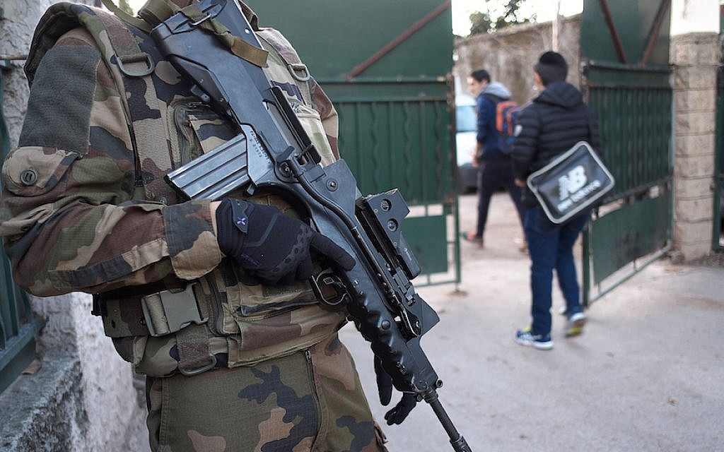 An armed French soldier securing the access to the La Source Jewish school in Marseille, southern France a day after a teenager, armed with a machete and a knife, wounded a teacher slightly before being stopped and arrested, Jan. 12, 2016. (Boris Horvat/AFP/Getty Images, via JTA) An armed French soldier securing the access to the La Source Jewish school in Marseille, southern France a day after a teenager, armed with a machete and a knife, wounded a teacher slightly before being stopped and arrested, Jan. 12, 2016. (Boris Horvat/AFP/Getty Images, via JTA)