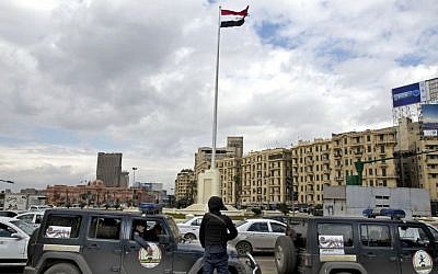 Egyptian police stand guard a day ahead of the fifth anniversary of the Jan. 25, 2011 uprising in Tahrir Square, Cairo, Egypt on Jan. 24, 2016. (AP Photo/Roger Anis)