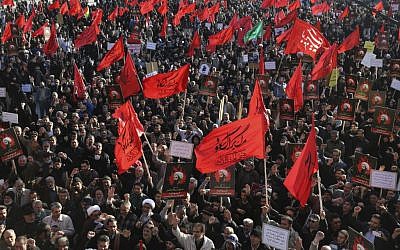 Iranian demonstrators chant slogans and hold anti-Saudi placards and flags during a rally to protest the execution by Saudi Arabia last week of Sheikh Nimr al-Nimr, a prominent opposition Saudi Shiite cleric, by Saudi Arabia, in Tehran, Iran, Monday, Jan. 4, 2016. (AP Photo/Vahid Salemi)