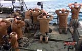 This photo released by the Iranian state-run IRIB News Agency on Wednesday, January 13, 2016, shows detention of American Navy sailors by the Iranian Revolutionary Guards in the Persian Gulf, Iran. (Sepahnews via AP)