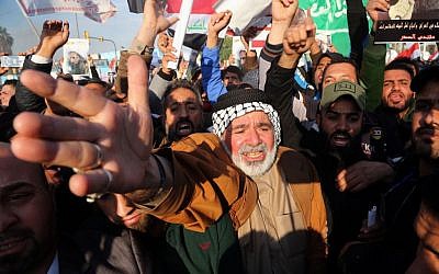 Followers of Shiite cleric Muqtada al-Sadr chant slogans against the Saudi government as they hold posters showing Sheik Nimr al-Nimr, who was executed in Saudi Arabia last week, during a demonstration in Baghdad, Iraq, Monday, Jan. 4, 2016. (AP Photo/Khalid Mohammed)