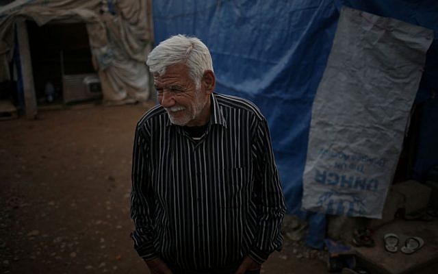 Ibrahim Mahmoud standing in Baharka refugee camp in Iraq’s northern Kurdish region after fleeing Islamic State militants, January 11, 2016. (AP Photo/Bram Janssen) Ibrahim Mahmoud standing in Baharka refugee camp in Iraq’s northern Kurdish region after fleeing Islamic State militants, January 11, 2016. (AP Photo/Bram Janssen)