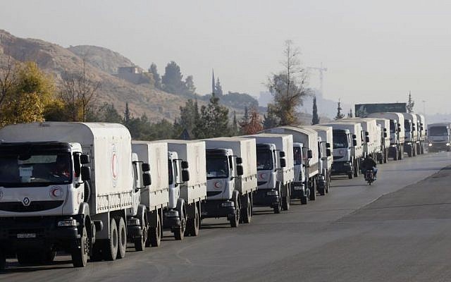 A convoy of trucks loaded with humanitarian supplies are seen heading to the besieged town of Madaya, some 24 kilometers in southwest Damascus, Syria, on Thursday, January 14, 2016 (AP Photo)