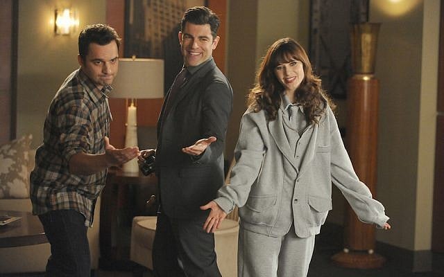 Schmidt (Max Greenfield), center, Nick (Jake Johnson), left, and Jess (Zooey Deschanel) in a scene from “New Girl,” Feb. 3, 2015. (FOX via Getty Images / JTA)