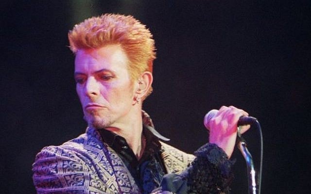 David Bowie performs during a concert celebrating his 50th birthday, at Madison Square Garden in New York, January 9, 1997. (AP Photo/Ron Frehm, File)