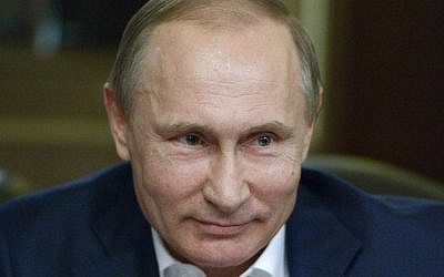 In this photo taken Tuesday, Jan. 5, 2016, Russian President Vladimir Putin sits for an interview with the German daily Bild at the Russian Black Sea resort of Sochi, Russia. (Alexei Nikolsky/Sputnik, Kremlin Pool Photo via AP)
