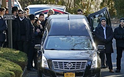 Family members gather at the rear of a hearse carrying the casket during the funeral for Dr. Robin Goldman, a 58-year-old pediatrician found slain inside her multimillion-dollar Scarsdale, NY, home on January 21, 2016. (AP/Kathy Willens)