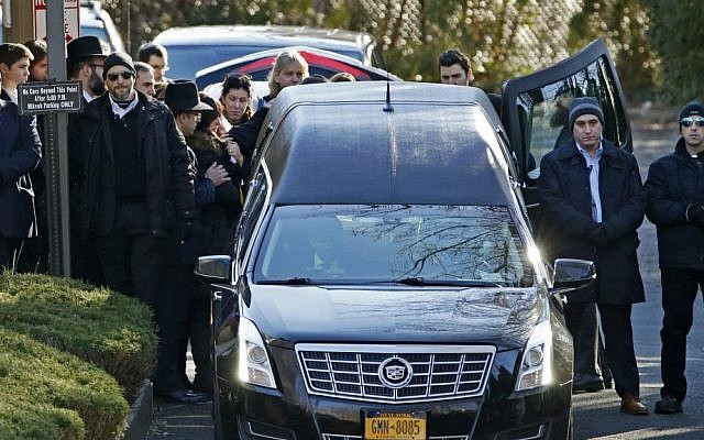 Family members gather at the rear of a hearse carrying the casket during the funeral for Dr. Robin Goldman, a 58-year-old pediatrician found slain inside her multimillion-dollar Scarsdale, NY, home on January 21, 2016. (AP/Kathy Willens) Family members gather at the rear of a hearse carrying the casket during the funeral for Dr. Robin Goldman, a 58-year-old pediatrician found slain inside her multimillion-dollar Scarsdale, NY, home on January 21, 2016. (AP/Kathy Willens)
