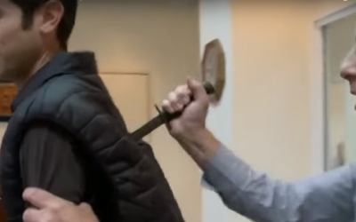 Reporter Eitam Lachover was accidentally stabbed on the job while demonstrating a protective vest, January  6, 2016 (YouTube / Channel 1 screenshot)
