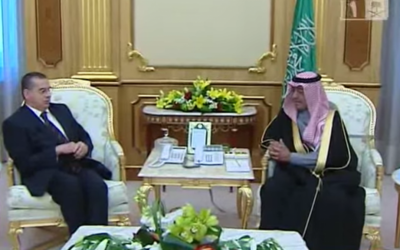 Basem Al-Agha, Palestinian ambassador to Saudi Arabia, meets Saudi deputy prime minister Muqrin bin Abdulaziz on February 10, 2014. (screen capture: YouTube)