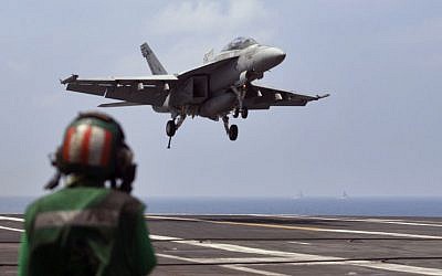 US Navy fighter jet approaching to land on the US Navy aircraft carrier USS Theodore Roosevelt during Exercise Malabar 2015 about 150 miles off Chennai, India, October 17, 2015. (AP/Arun Sankar K., File)