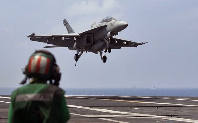 US Navy fighter jet approaching to land on the US Navy aircraft carrier USS Theodore Roosevelt during Exercise Malabar 2015 about 150 miles off Chennai, India, October 17, 2015. (AP/Arun Sankar K., File) US Navy fighter jet approaching to land on the US Navy aircraft carrier USS Theodore Roosevelt during Exercise Malabar 2015 about 150 miles off Chennai, India, October 17, 2015. (AP/Arun Sankar K., File)
